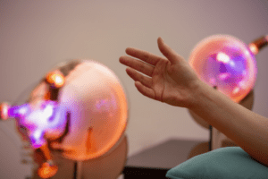 a hand in front of a theraphi machine