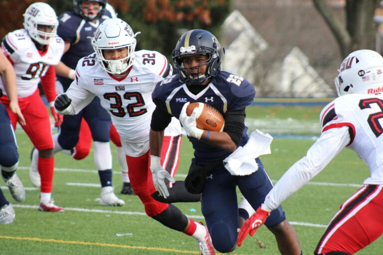 image of football player running with the ball. haus of life and co