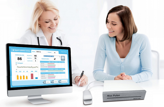 Max pulse image along with female doctor and patient reviewing results. haus of life and co